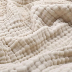 Mousseline plaid van katoen over een bank